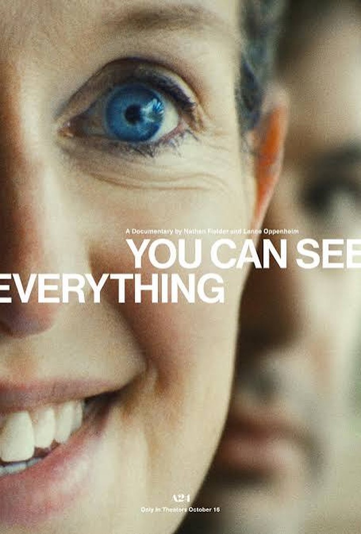 You Can See Everything theatrical poster: an extreme close-up of a smiling woman with a bright blue eye, another face blurred behind her, A24, only in theaters October 16.